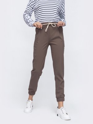 Практичні штани джоггери бежевого кольору - фото