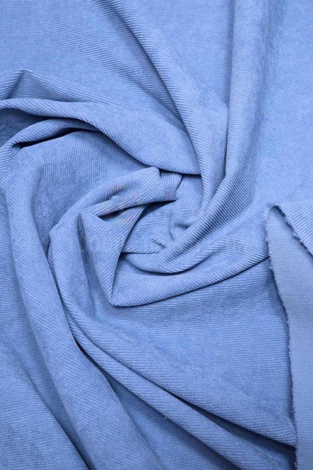 Вельветовий брючний костюм блакитного кольору - фото